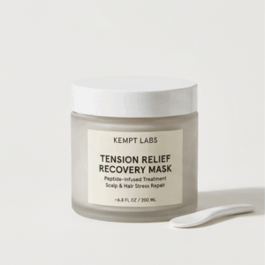 A chic, minimalist matte white jar of KEMPT Labs Tension Relief Recovery Mask resting on a clean white surface.
